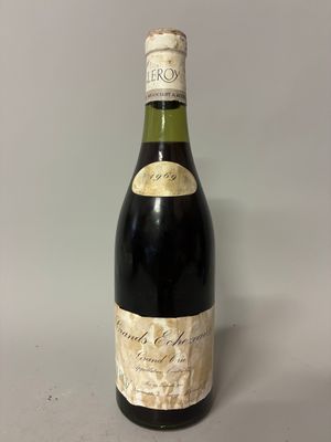 a close up of a bottle of wine sitting on a table