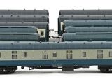 three blue and white train cars sitting next to each other on a white surface