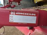 the back end of a red tractor with a sticker on it ' s side
