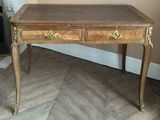 a wooden table with two drawers on it in a room