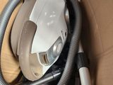 a box with a vacuum and a hose inside of it