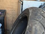 a pile of tires and other items in a garage