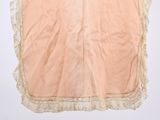 an image of a pink shirt hanging on a hanger
