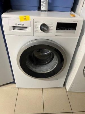 a washer and a dryer in a small room