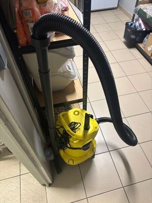 a vacuum that is sitting on the floor in the kitchen