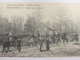 a black and white photo of a group of people riding horses