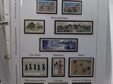 a lot of stamps on the pages of a binder
