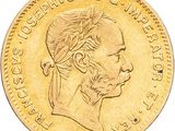 une image représentant une pièce d'or sur laquelle figure un homme coiffé d'une coiffe