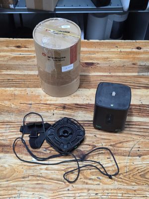 an image of a table with a speaker and a box on it