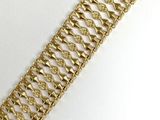 an image of a close up of a gold bracelet on a white surface