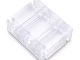 a close up of a clear plastic object on a white background