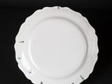 an image of a white plate on a black background
