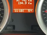 a close up of a car dashboard with a speedometer and gauges