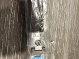a cell phone that is wrapped in plastic on a table