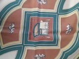 a picture of a scarf with a coat of arms on it