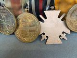 a bracelet with medals and medals on it on a table