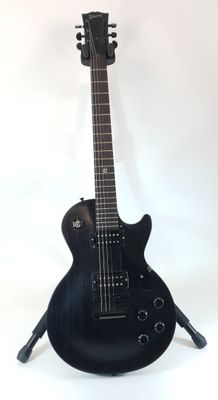 black electric guitar on stand on white background with white background