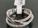 a close up of a diamond ring on a black surface