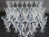 a lot of wine glasses that are sitting on a table