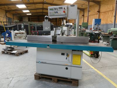 an image of a machine in a factory with a lot of machinery
