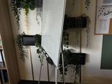 a white board on a stand in the corner of a room
