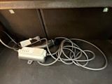 a lot of wires that are plugged into the trunk of a car
