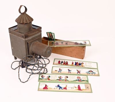 a small lantern that is sitting next to some cards