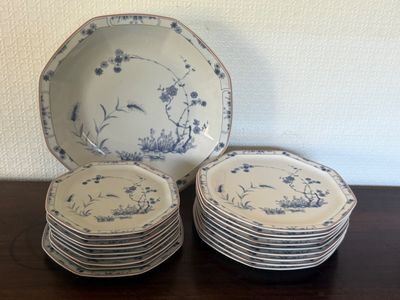 a stack of plates with blue and white designs on them