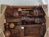 a cardboard box with a bunch of wooden tools inside of it