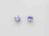 a pair of tanzanite earrings on a white background