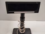 an image of a television on a stand with a cord