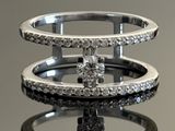 une bague en diamant posée sur une surface miroitante, avec son reflet