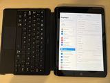 two laptops sitting next to each other on a table
