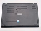 a black laptop with a blue sticker on it