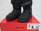 the box is full of a pair of black snow boots