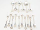 a lot of silver spoons and spoons on a table