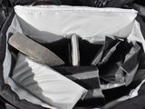 a black bag filled with various items in it