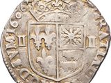 a close up of a coin with a coat of arms on it