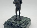 bronze figurine of a man holding a baseball bat on a marble base