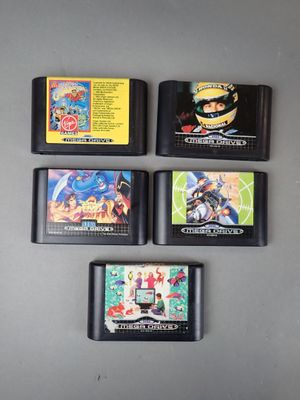 four gameboy games on the table next to each other