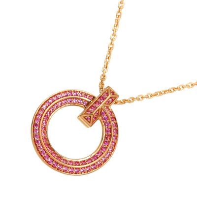 a close up of a pink necklace with a gold chain