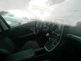 a view of the inside of a car from the driver ' s seat