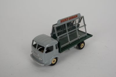 a toy truck that is sitting on a white surface