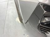 a close up view of a car ' s front bumper
