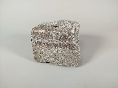 a rock that is sitting on a white surface