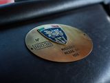 a close up of a luggage bag with a badge on it