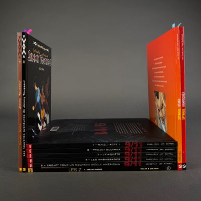 three books are stacked on top of each other on a table