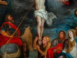 a painting of jesus on the cross surrounded by other people