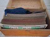 a wooden box filled with different types of carpet