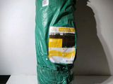 a green bag of food sitting on a table